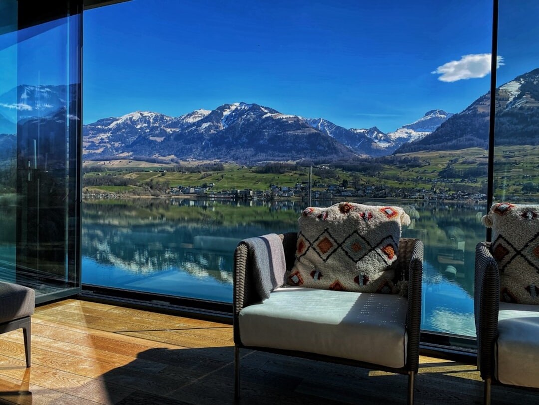 Luxurious alpine hotel suite with mountain view through large windows