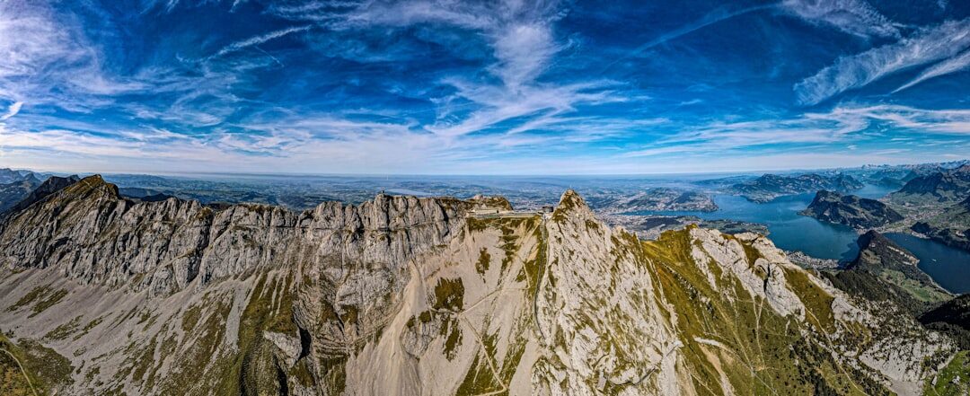 Dramatic view of Swiss Alps peaks at dusk with warm light on the mountain ridges